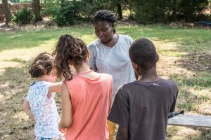 A volunteer with the children at the center Photo