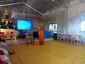In the monastery meeting room, our main host Too Neuk is giving a speech Photo