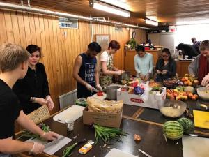 Cooking preparations with the camp team Photo